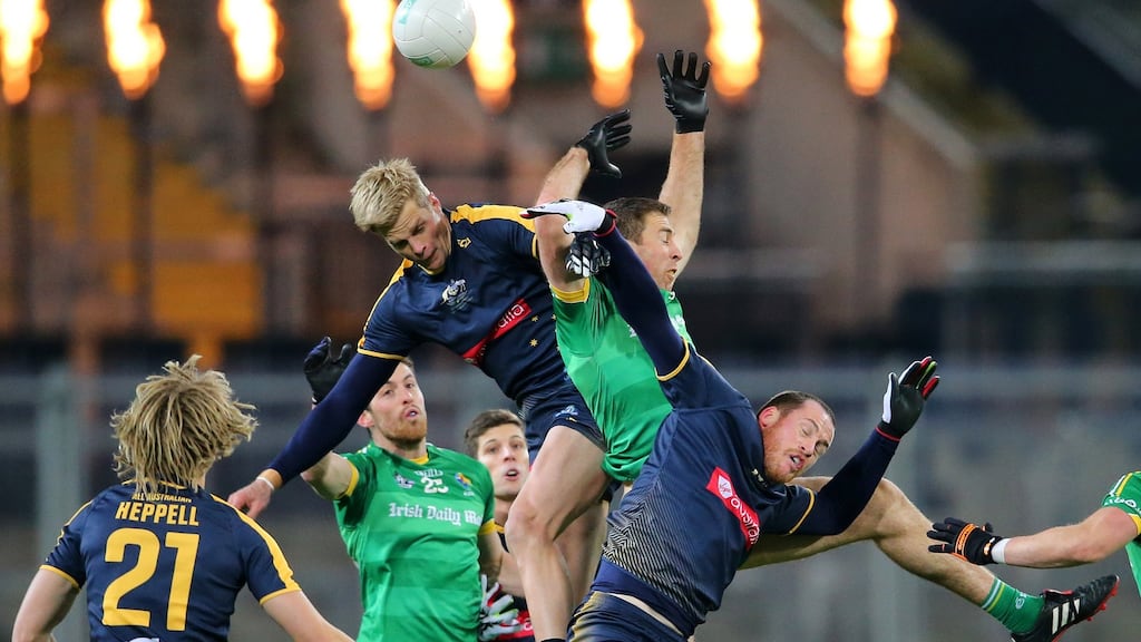 Ireland’s Gary Brennan with Nick Riewoldt and Jarryd Roughead of Australia during last year’s International Rules Test at Croke Park. Photo: Inpho