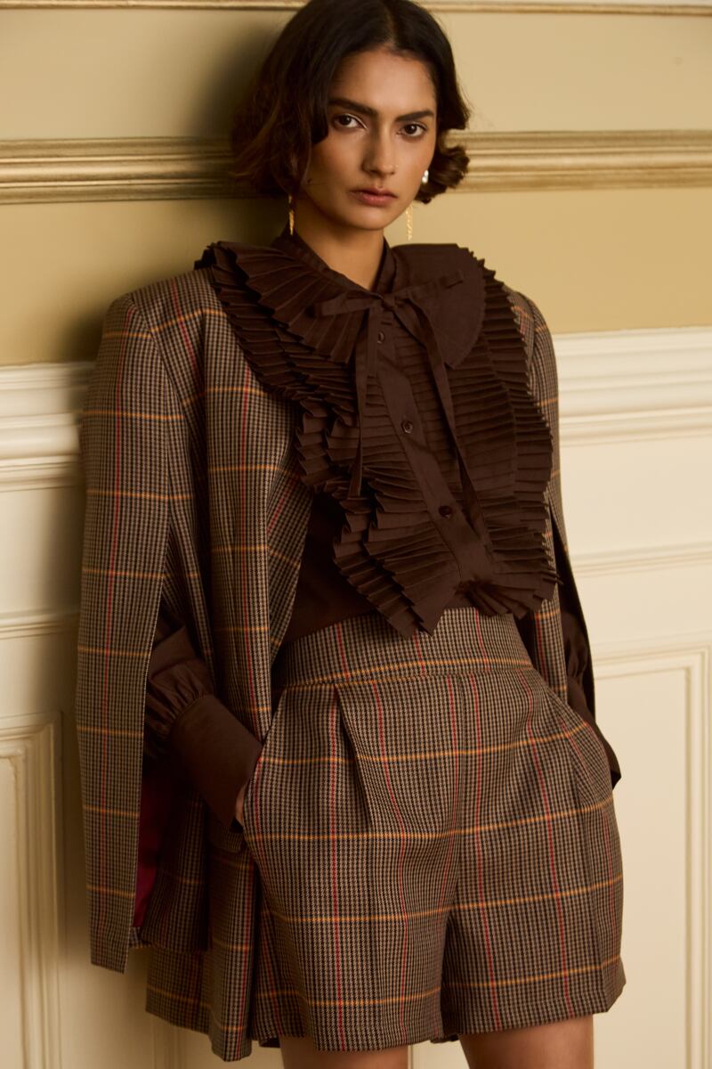 A check Italian wool blazer €395, hot pants €220 and shirt €385