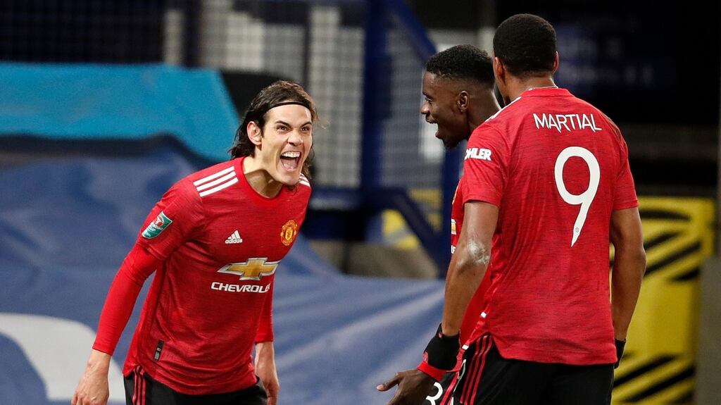 Edinson Cavani of Manchester United celebrates with team mates Axel Tuanzebe and Anthony Martial after scoring their side’s first goal during the Carabao Cup quarter-final win over Everton. Photo: Clive Brunskill/Getty Images