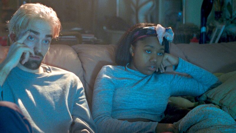 Robert Pattinson and Talia Webster in Good Time
