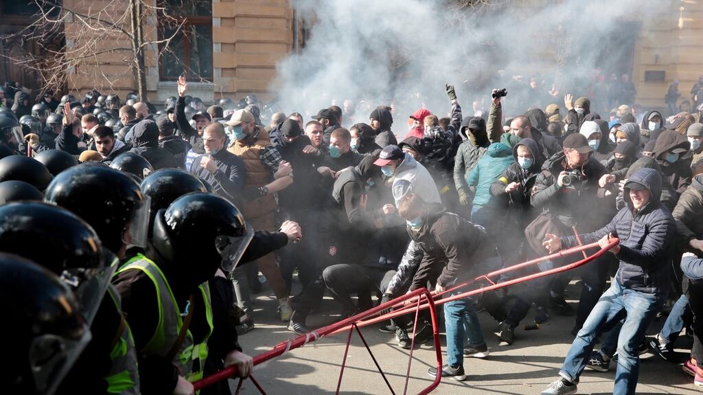 Far-right demonstrators clashing with riot police outside the presidential administration building in Kiev on March 9th. Photograph: Serhii Nuzhnenko/Radio Free Europe/Radio Liberty via AP