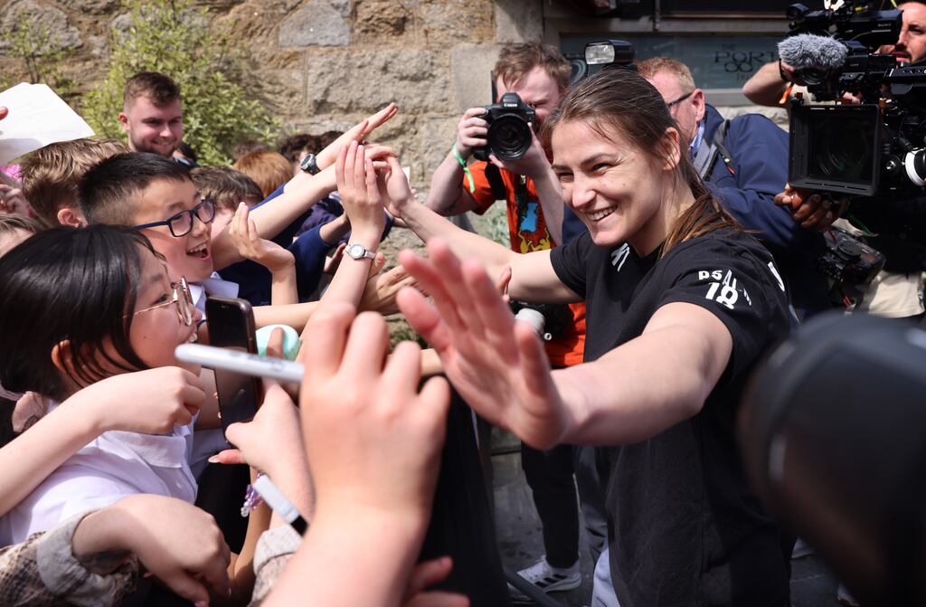 Students from Holy Cross School, meet Katie Taylor, at the Taylor Vs Cameron public workout, at Pembroke Square, Dundrum Town Centre, Dublin, on Wednesday. Photograph: Dara Mac Dónaill/The Irish Times