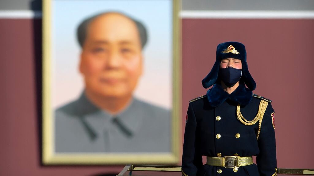 A member of a Chinese honour guard wears a face mask as he stands guard on Tiananmen Square in Beijing on Tusday. Photograph: Mark Schiefelbein/AP
