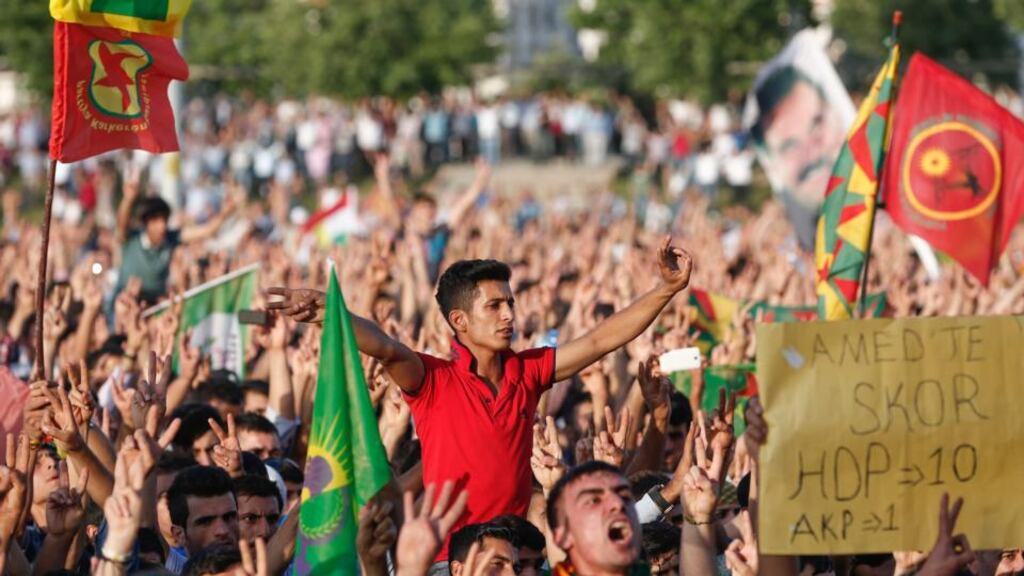 Supporters of the Peoples’ Democracy Party celebrate the results of parliamentary elections in Diyarbakir on Monday. With turnout of over 86 per cent, the election is regarded as a triumph for Turkey’s democratic credentials. Photograph: Sedat Suna/EPA