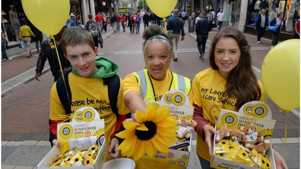 Volunteers for Irish Hospice Sunflower Day photographed on Grafton Street earlier this year from left Mark O’Donnell Elizabeth Mary Donnelly and Leah Whelan. Photograph: Brenda Fitzsimons / The Irish Times