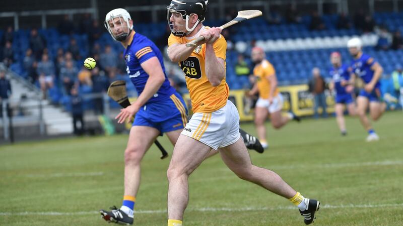 Antrim’s Ciaran Clarke scores a crucial goal against Clare during the opening league clash at Corrigan Park. Photograph: Colm Lenaghan/Pacemaker