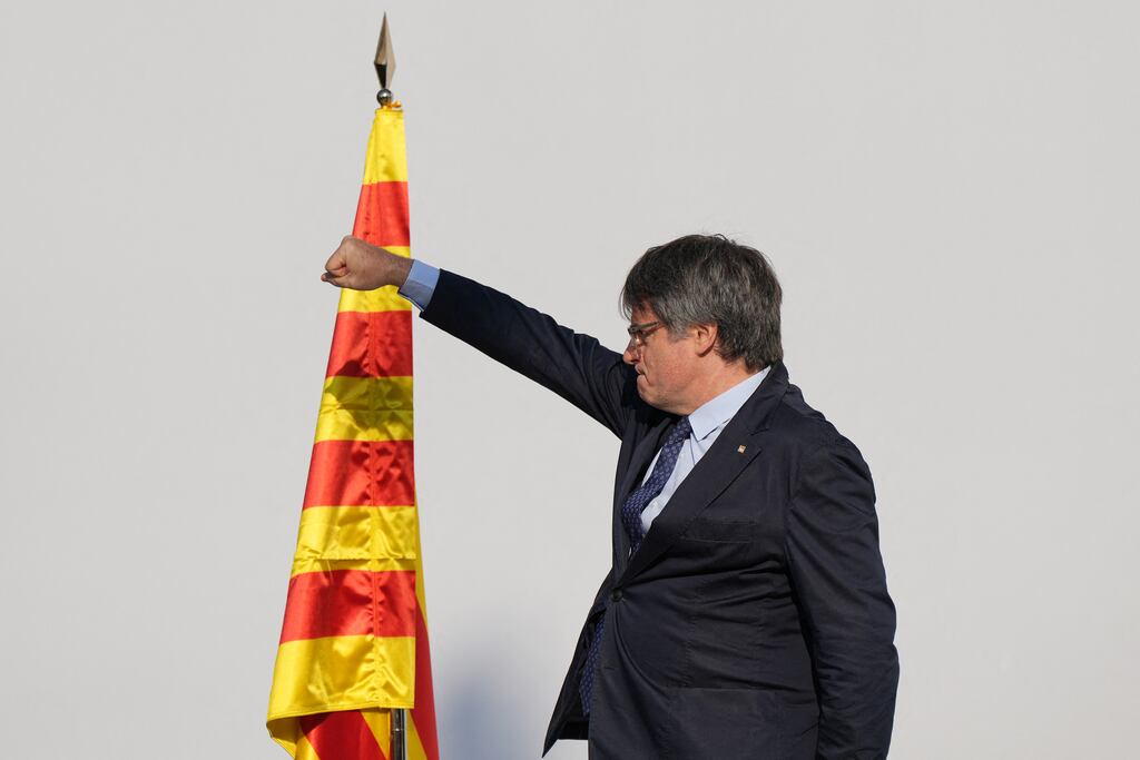 Catalonia's exiled separatist leader Carles Puigdemont on stage in Barcelona on Thursday. He evaded police arrest after giving a speech in the Catalan capital. Photograph: Cesar Manso/Getty Images