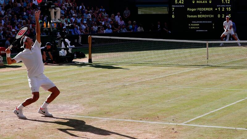 Federer serves an ace during his semifinal win over Berdych. Photo: Adrian Dennis/Getty Images