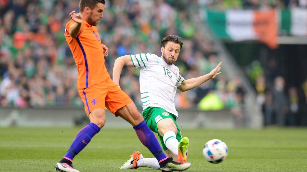Republic of Ireland midfielder Harry Arter slides in to tackle Kevin Strootman of the Netherlands during the friendly international at the Aviva Stadium. Photograph: Aidan Crawley/EPA