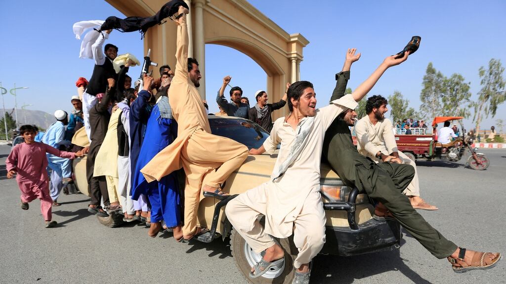 People celebrating the ceasefire in the Rodat district of Nangarhar province in Afghanistan. Photograph: Reuters