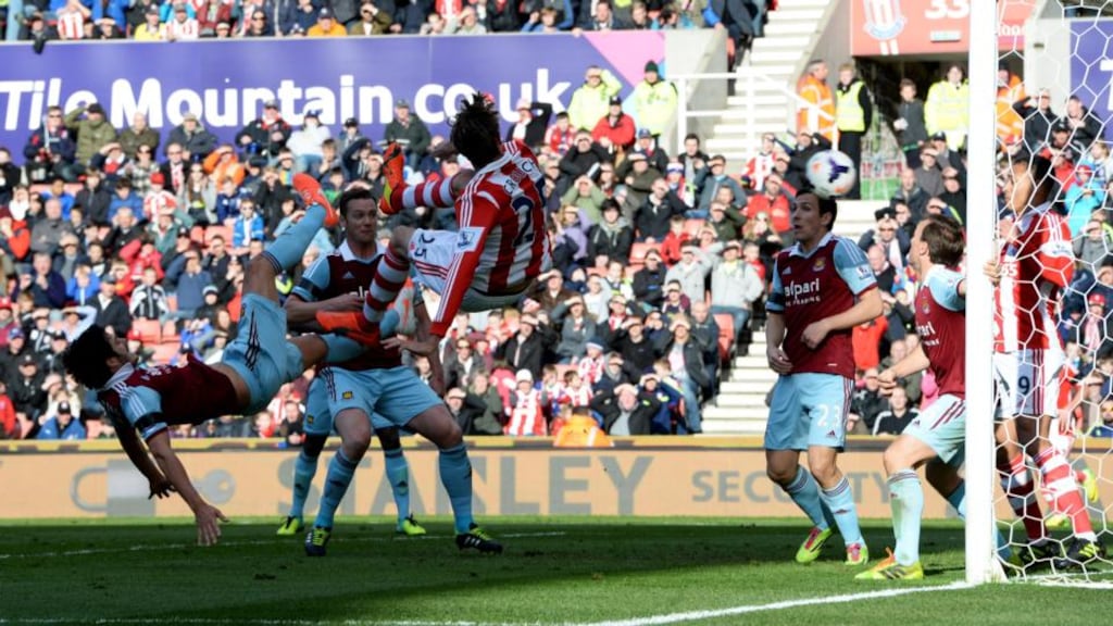 Peter Crouch’s shot deflects into the goal off Peter Odemwingie for Stoke City’s first goal in their Premier League game against Aston Villa at Villa Park. Photograph: Ross Kinnaird/Getty Images