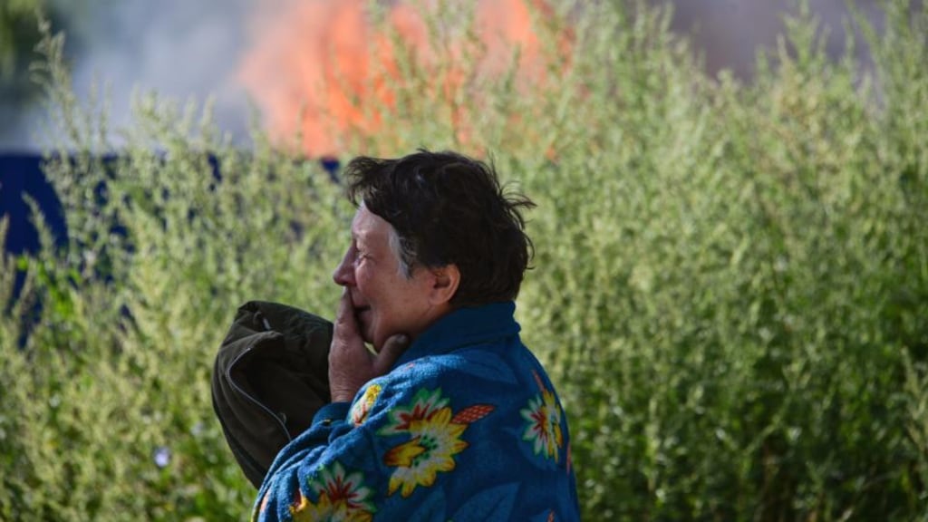 A Ukrainian woman cries in front of her house which was destroyed by shelling in Slaviansk in the Donetsk region of Ukraine today. Photograph: EPA