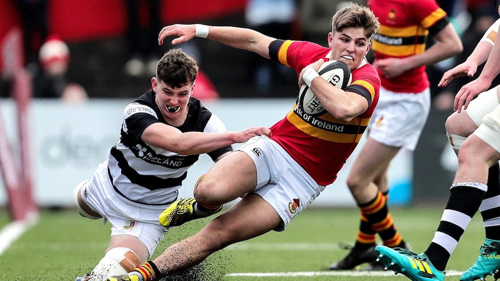 Christian Brothers College’s Mark O’Connor is tackled by John Forde of Presentation Brothers College during the Munster Schools Senior Cup final  at Irish Independent Park in Cork. Photograph: Laszlo Geczo/Inpho