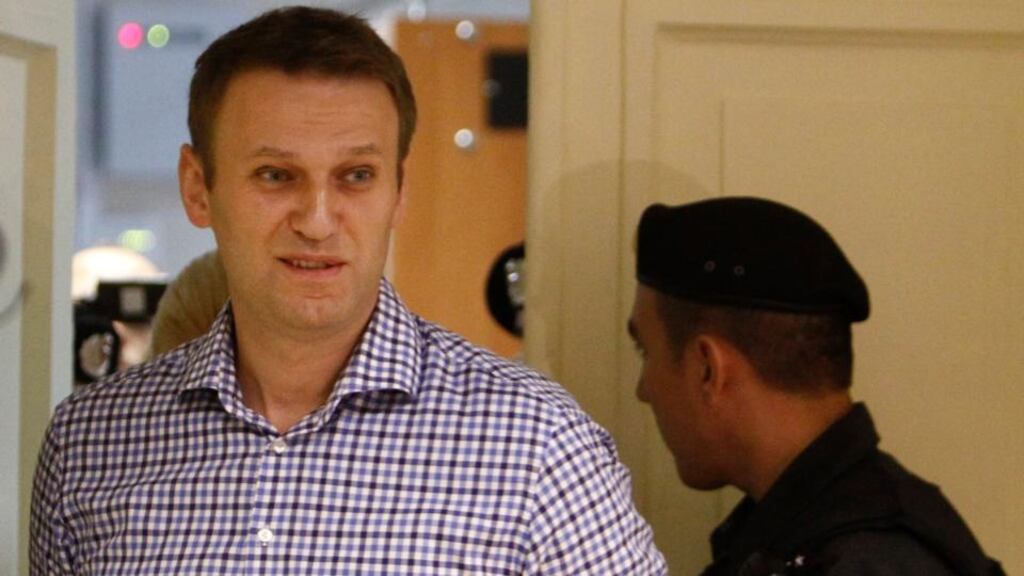 Alexei Navalny walks into the courtroom to attend a hearing in Kirov, today. He was convicted of stealing from a state timber company, a verdict that could prevent him challenging Vladimir Putin for the presidency. Prosecutors have asked the court to jail Navalny for six years, a term that would keep him in prison until after the next presidential election in 2018. Photograph: Sergei Karpukhin/Reuters