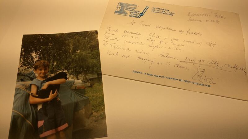 A doctor’s note next to a photo of a little girl reads: ‘Diagnosis: survived by a whisker. Prognosis: a fresh start at five-years-old!’, at Sarajevo’s War Childhood Museum. Photograph: Daniel McLaughlin