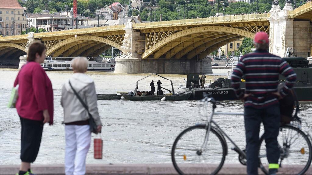 Onlookers watch the rescue operation at the Margrit bridge in Budapest, where the Hableány sank on Wednesday after a collision with a larger cruise ship. Photograph: Noemi Bruzak/EPA