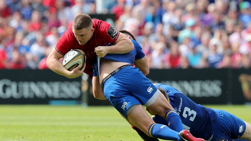 Munster’s Andrew Conway is tackled by Ross Byrne and Garry Ringrose of Leinster during the Guinness Pro 14 semi-final  at the RDS. Photograph: Billy Stickland/Inpho