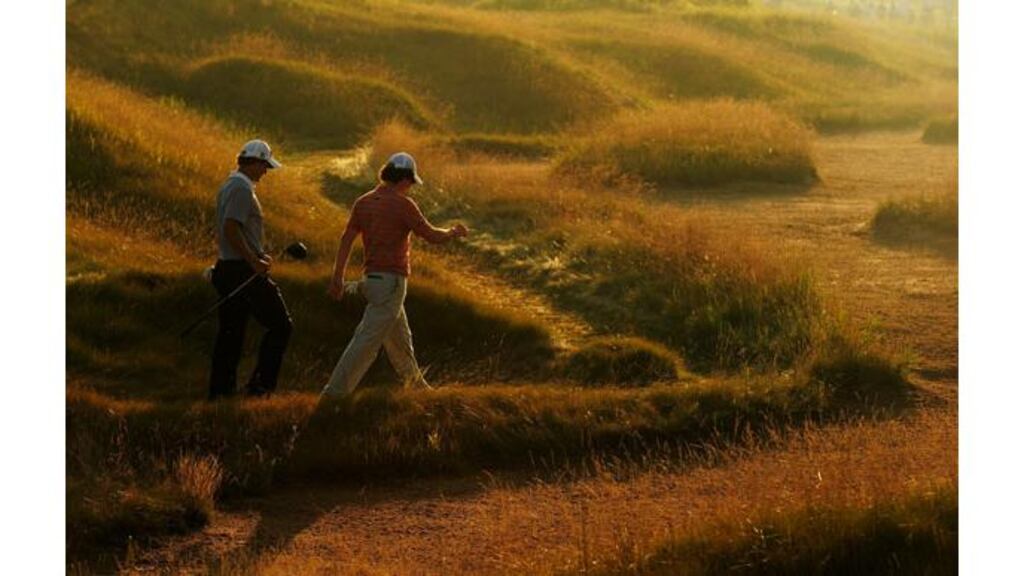 Northern Ireland's Rory McIlroy and Australia's Adam Scott walk off the ninth tee during the first round of the 92nd US PGA Championship at Whistling Straits in Kohler, Wisconsin. - (Photograph: Stuart Franklin/Getty Images)