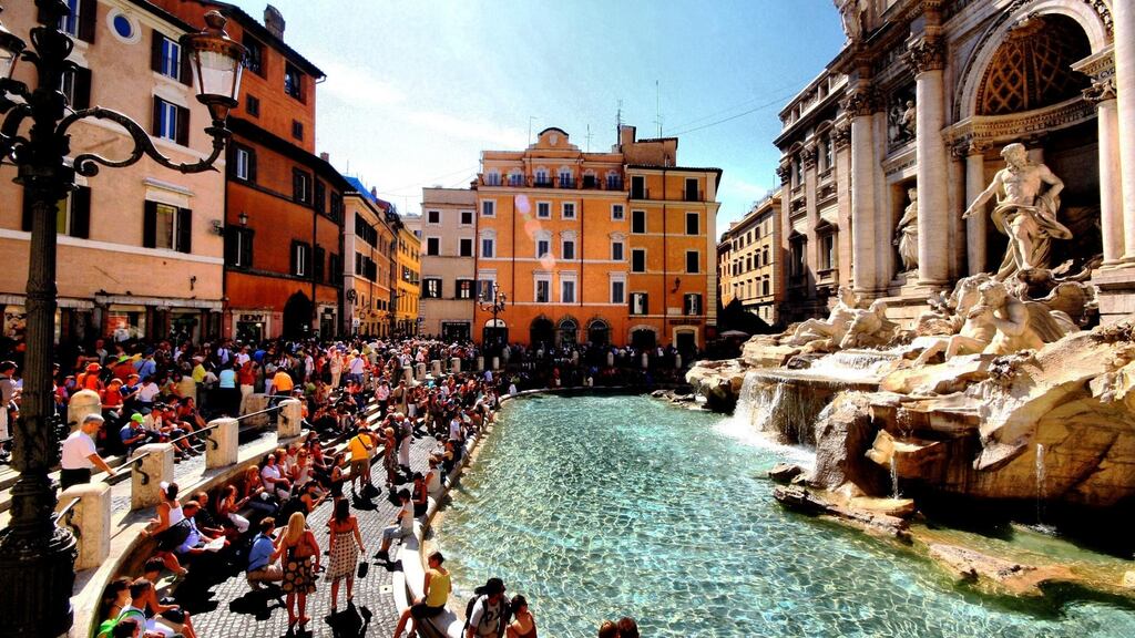 Tourists enjoy Rome’s Trevi Fountain. File photograph: L Toshio Kishiyama/Getty Images/Flickr