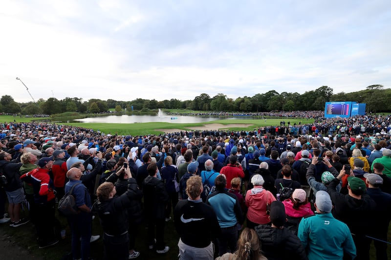A general view of the 18th green as Rory McIlroy of Northern Ireland putts during the third playoff hole. Photograph: Tom Dulat/Getty