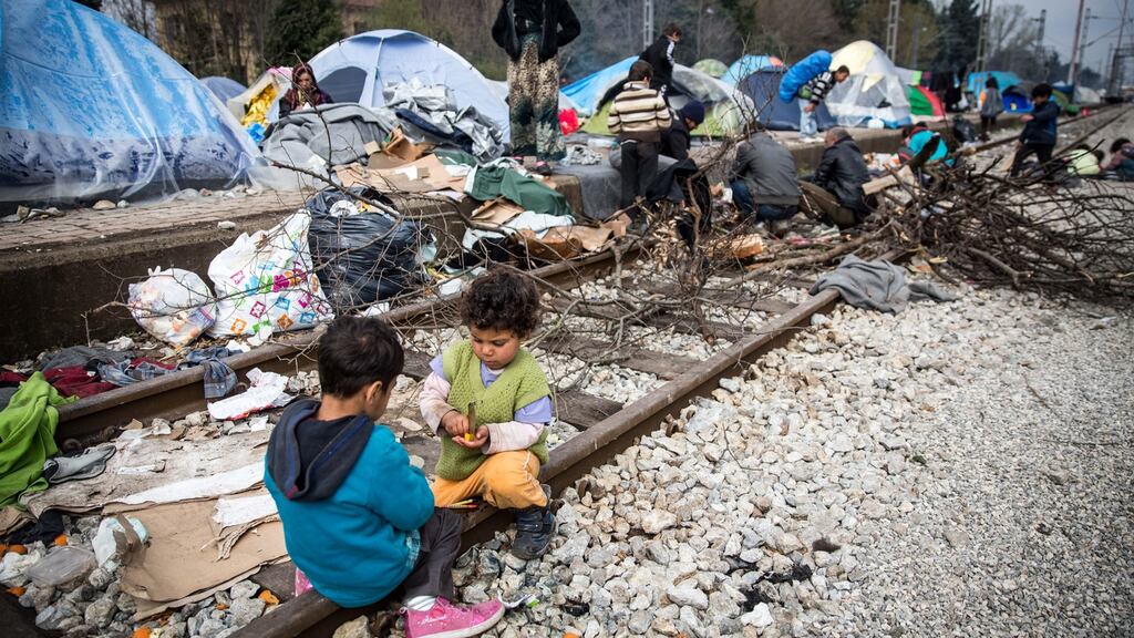Children play on the railway tracks at the Idomeni refugee camp on the Greek border with Macedonia on Thursday, March 17th. Thousands of migrants are stranded at the  camp. Photograph:  Matt Cardy/Getty Images