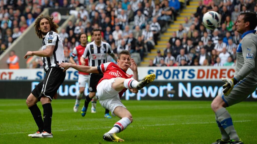 Arsenal’s Lourent Koscielny scores against Newcastle United during their English Premier League match at St James’ Park. Photograph: Reuters