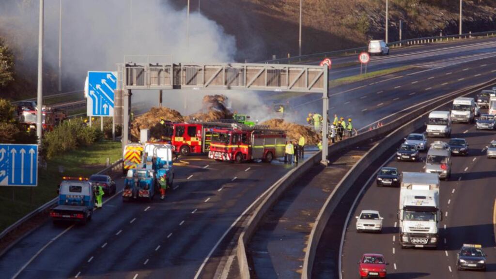 Members of the emergency services are attempting to extinguish a fire on the M50 near Blanchardstown this evening. Photograph: Gareth Chaney/Collins