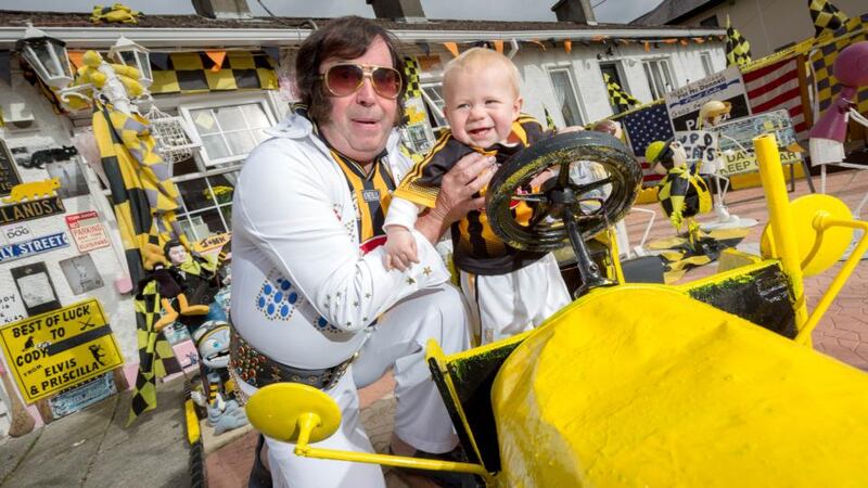 Elvis impersonator Myles Kavanagh and his grandson Preslie Kavanagh, aged 8 months, pictured in Kilkenny ahead of this weekend’s All Ireland senior hurling final between Kilkenny and Galway. Photograph: Dylan Vaughan