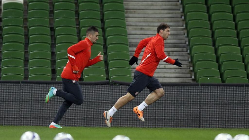 Serbia’s Aleksander Kolarov and Branislav Ivanovic during training at the Aviva Stadium yesterday. Photograph: Donall Farmer/Inpho