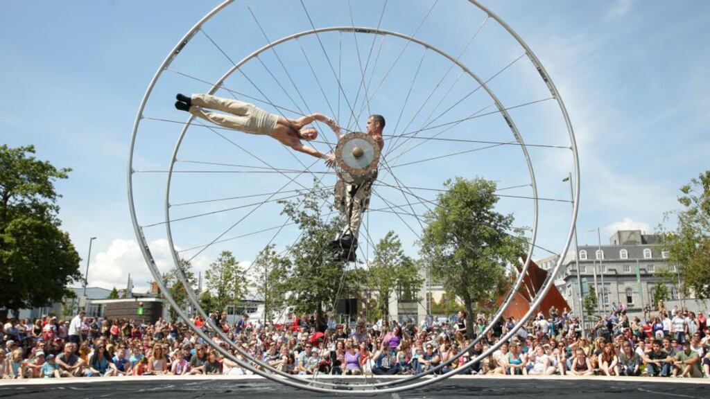 Maxime Bourdon and Sébastien Bruas from French company Les Philébulistes performing on giant moving wheels during their acrobatic show Arcane at Eyre Square during the Galway Arts Festival in 2011. Photograph: Joe O’Shaughnessy