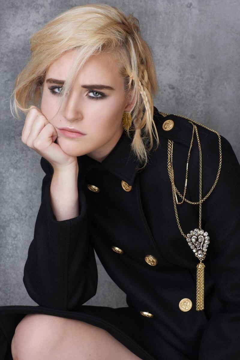 Black coat €875 Red Valentino, Brown Thomas; tassel necklace €475 and earrings €165 Loulerie.