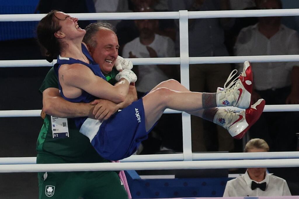 Kellie Harrington of Ireland celebrates with Zaur Antia after her win over Wenlu Yang of China in their Women's 60kg final in the Paris 2024 Olympic Games. Photograph: EPA