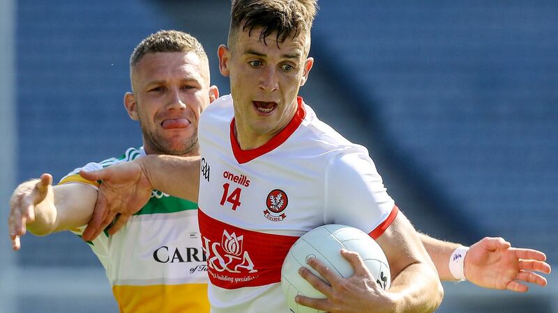 Derry’s Shane McGuigan in action against Offaly’s Anton Sullivan during the Allianz Football League Division 3 final at Croke Park. Photograph: Lorraine O’Sullivan/Inpho