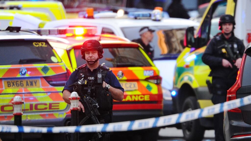Armed police stand guard near the Monument in London after several people were injured in a terrorist incident in the British capital. The suspect was shot dead by police. Photograph: Daniel Sorabji/AFP via Getty