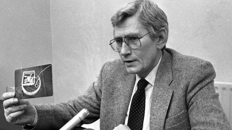 File photograph of former SDLP deputy first minister Seamus Mallon holding up a picture taken of the bugging equipment found in his Dublin residence. A dinner in honour of Mr Mallon was attended by hundreds in Armagh. Photograph: Kevin McMahon/The Irish Times