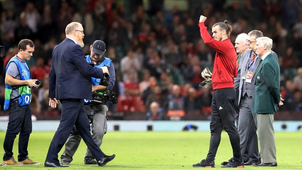 Gareth Bale receives a Golden Boot award for scoring 30 goals for Wales ahead of his side’s friendly defeat to Spain at the Millennium Stadium. Photograph: Nick Potts/PA