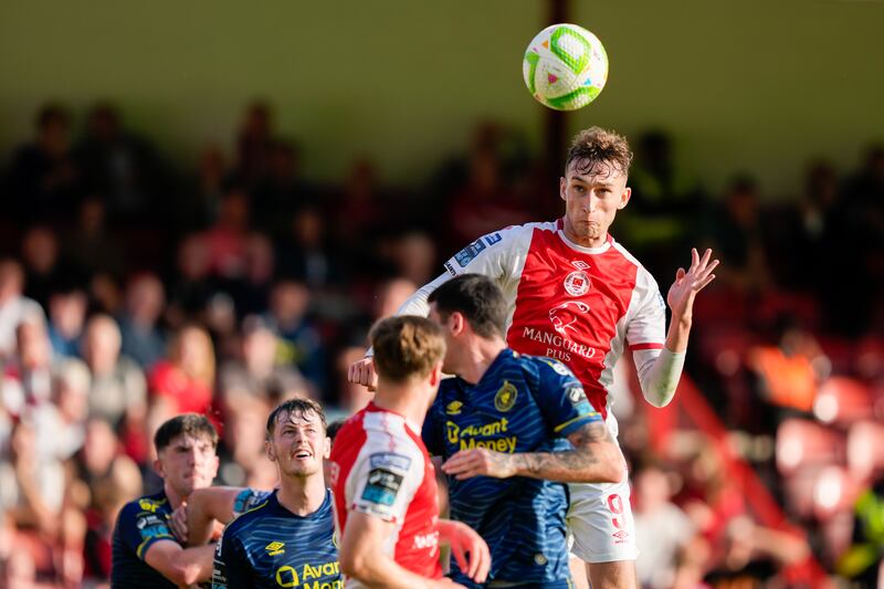 Mason Melia heads home his first goal of the game for St Pat's. Photograph: James Lawlor/Inpho