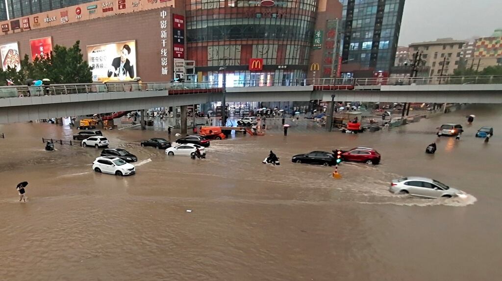 Vehicles are stranded after a heavy downpour in Zhengzhou city, central China’s Henan province on July 21st, 2021. Heavy flooding has hit central China following unusually heavy rains, with the subway system in the city of Zhengzhou inundated with rushing water.Photograph: Chinatopix/AP