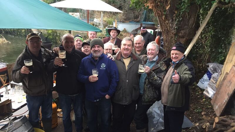 Dublin salmon anglers enjoying New Year’s festivities at Islandbridge on the River Liffey.