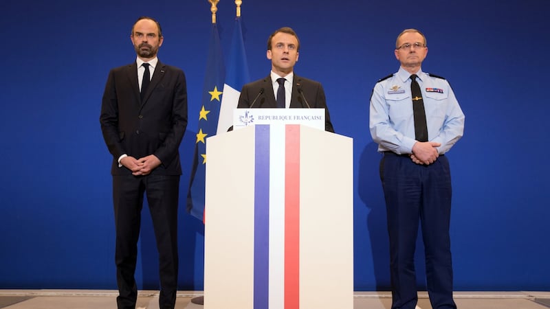 French president Emmanuel Macron delivers a speech at the Ministry of the Interior in Paris attended by prime minister Edouard Philippe and director general of the Gendarmerie Nationale Richard Lizurey after a hostage situation in a supermarket in the village of Trebes. Photograph: Philippe Wojazer/Reuters