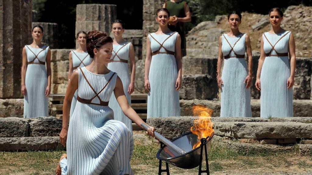Greek actress Katerina Lehou, playing the role of High Priestess, lights a torch from the sun’s rays reflected in a parabolic mirror during the Olympic flame lighting ceremony for the Rio 2016 Olympic Games at the site of ancient Olympia in Greece, April 21, 2016. Photograph: Alkis Konstantinidis/Reuters