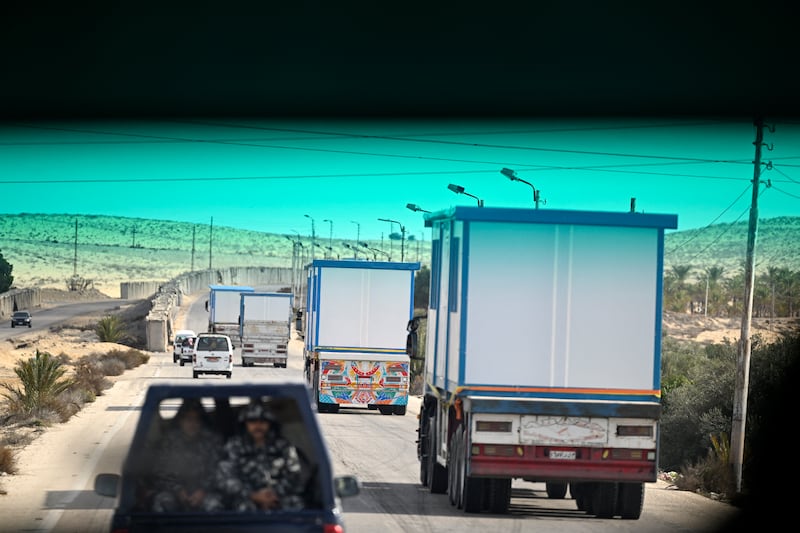 Egyptian soldiers accompany trucks carrying prefabricated houses towards the border with the Gaza Strip, on Sunday. Photograph: Khaled Desouki/AFP/Getty