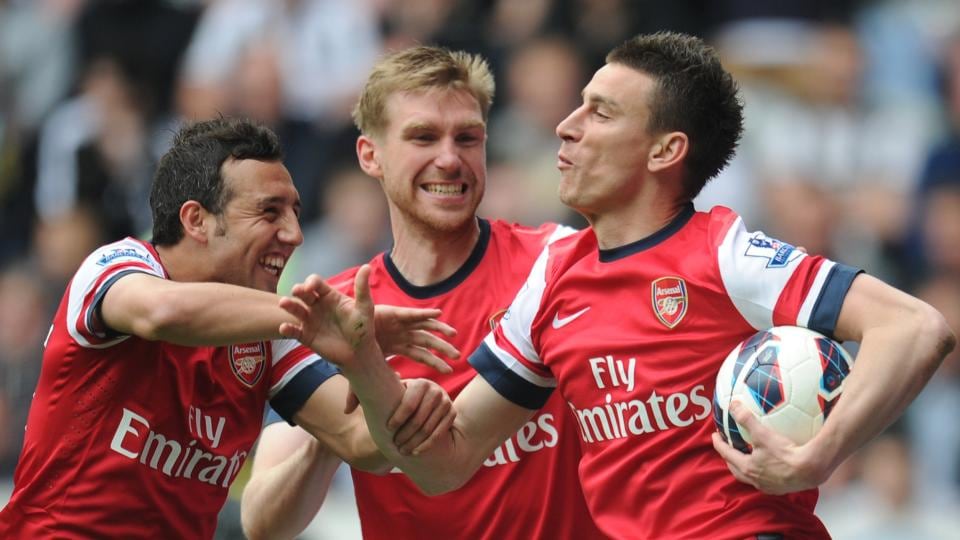 Arsenal’s Laurent Koscielny (right) celebrates scoring the £30 million winner against Newcastle United. Photograph: Owen Humphreys/PA Wire.