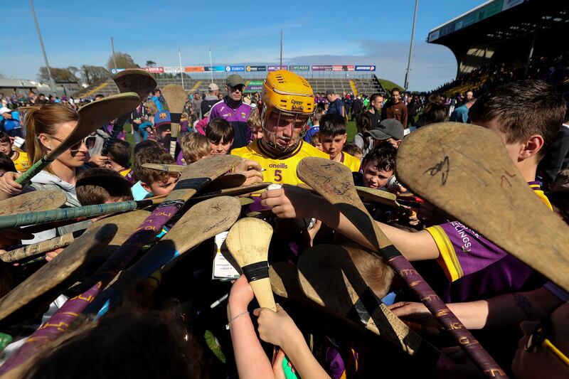 Wexford's Simon Donohoe signs autographs after the game. Photograph: Bryan Keane/Inpho