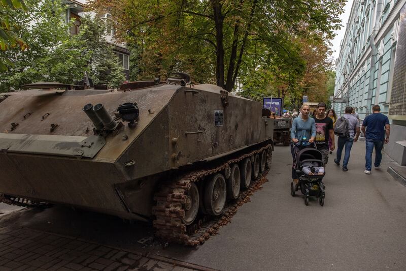 Pedestrians pass Russian armored military vehicles that were destroyed in fights with the Ukrainian army, displayed in downtown Kyiv, Ukraine on Wednesday. Photograph: Roman Pilipey/EPA