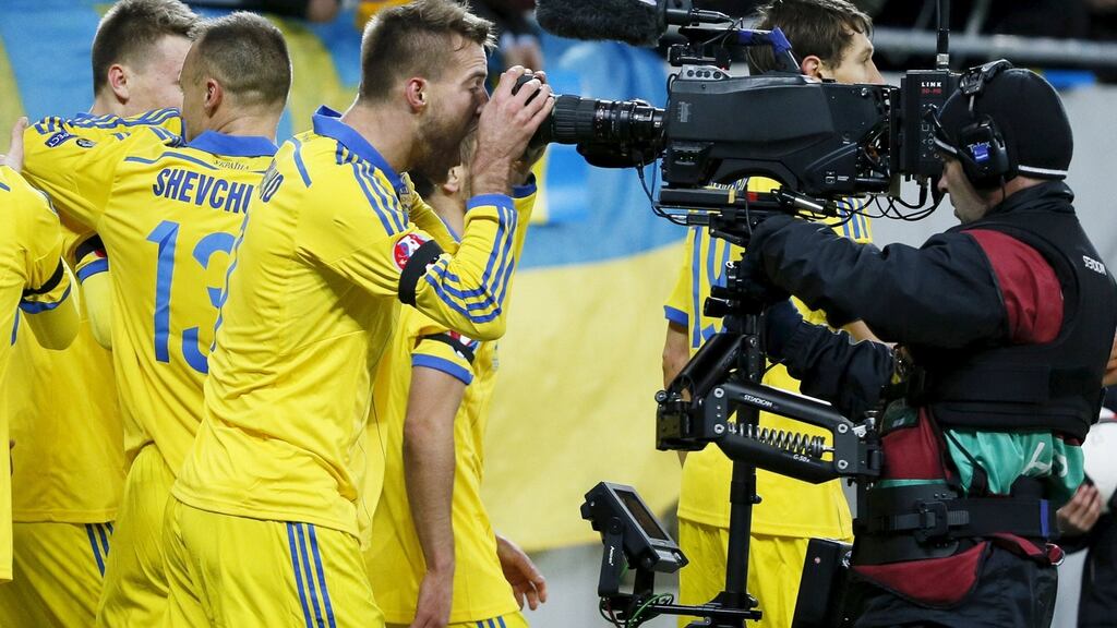 Ukraine’s Andriy Yarmolenko (C) celebrates scoring his side’s opening goal in Lviv Photograph: Gleb Garanich/Reuters