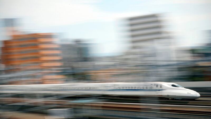The Shinkansen, known in English as the bullet train, passes through the station in Hamamatsu. Photograph: Adrian Dennis/AFP/Getty