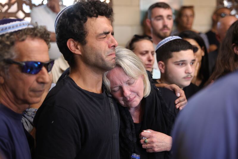 Kim Damti's mother Jennifer mourns during her funeral at a cemetery in Israel on Thursday. Ms Damyi (22) was one of 260 people killed by Hamas militants at music festival on Saturday. Photograph: EPA