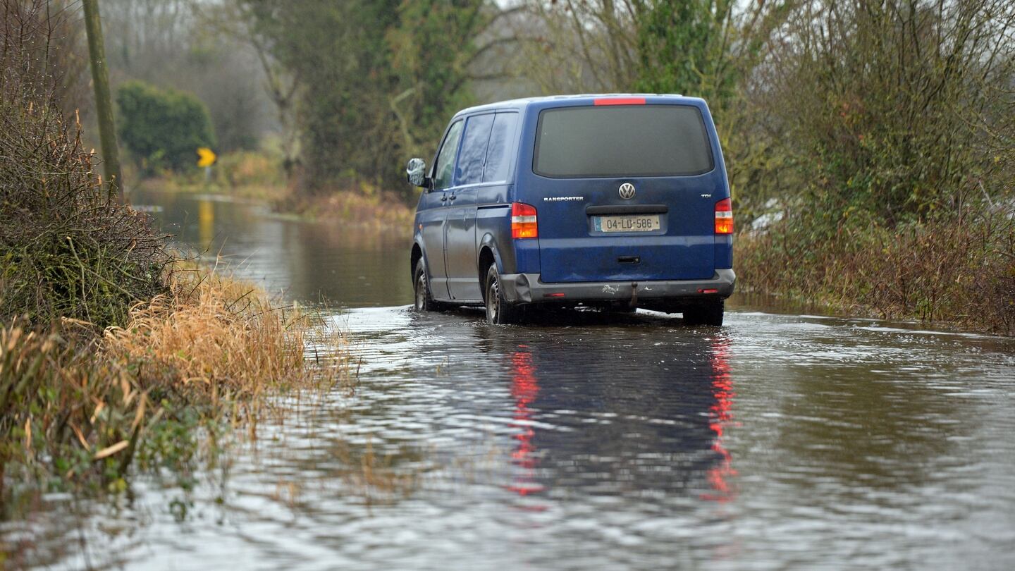 A van negotiates a flooded road at Clondra in Co Longford. Photograph: Eric Luke/The Irish Times