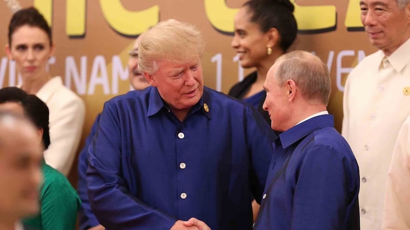 Donald Trump (left) shakes hands with Russia’s president Vladimir Putin at the APEC Economic Leaders’ Meeting on Saturday. Photograph: AFP